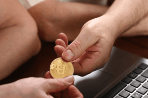 Image of hand with Bitcoin exchange
